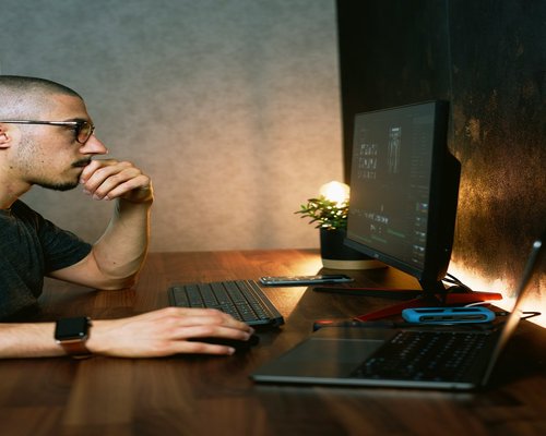 person sitting at computer organizing thoughts